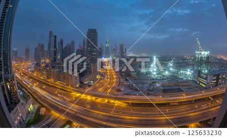 Dubai downtown skyline night to day aerial timelapse with traffic on highway 125633230