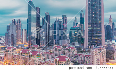 Skyline view of the buildings of Sheikh Zayed Road and DIFC night to day timelapse in Dubai, UAE. 125633233