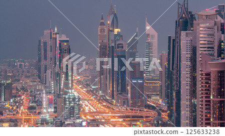 Aerial view to skyscrapers on Dubai downtown and Sheikh Zayed road day to night timelapse, Dubai, United Arab Emirates 125633238