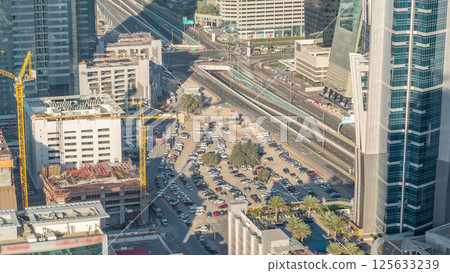 Aerial view of traffic on Business Bay with parking timelapse. 125633239