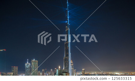 Dubai downtown cityscape with Burj Khalifa, LightUp light show aerial timelapse Dubai downtown cityscape with Burj Khalifa, LightUp light show aerial timelapse 125633315