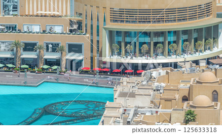 Balcony of shopping mall and pool of fountains timelapse in Dubai, United Arab Emirates 125633318