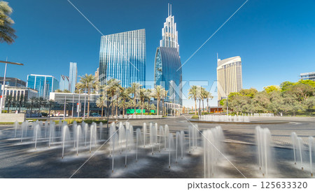 Fountains near main entrance to the tallest skyscraper timelapse hyperlapse, Dubai 125633320