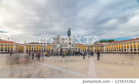 Triumphal arch at Rua Augusta and bronze statue of King Jose I at Commerce square timelapse hyperlapse in Lisbon, Portugal. 125633362