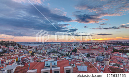 Lisbon at sunset aerial panorama view of city centre with red roofs at Autumn evening timelapse, Portugal Lisbon at sunset aerial panorama view of city centre with red roofs at Autumn evening timelapse, Portugal 125633363