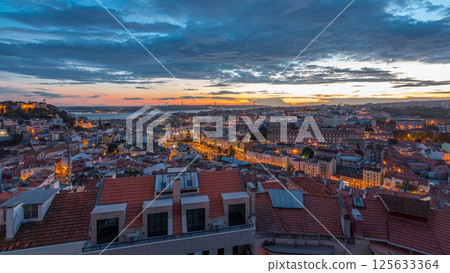Lisbon after sunset aerial panorama view of city centre with red roofs at Autumn day to night timelapse, Portugal 125633364