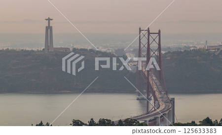 Panoramic overview during sunrise over Lisbon and Almada from a viewpoint in Monsanto morning timelapse. Panoramic overview during sunrise over Lisbon and Almada from a viewpoint in Monsanto morning timelapse. 125633383