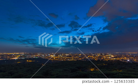 Panoramic view over Lisbon and Almada from a viewpoint in Monsanto night to day timelapse. Panoramic view over Lisbon and Almada from a viewpoint in Monsanto night to day timelapse. 125633385