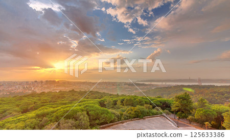 Panoramic sunrise view over Lisbon and Almada from a viewpoint in Monsanto morning timelapse. Panoramic sunrise view over Lisbon and Almada from a viewpoint in Monsanto morning timelapse. 125633386