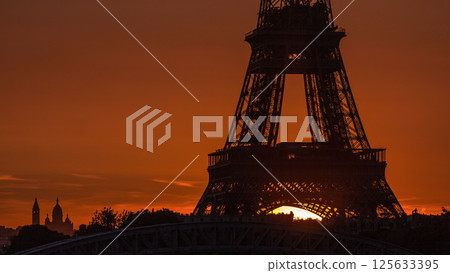 Eiffel Tower sunrise timelapse with boats on Seine river and in Paris, France. 125633395