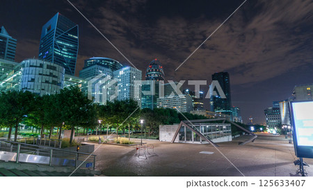 Paris cityscape with modern buildings in business district La Defense timelapse hyperlapse by night. Paris, France 125633407