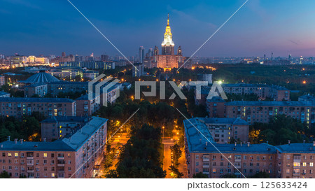 Moscow State University night to day timelapse before sunrise aerial view from rooftop. Moscow State University night to day timelapse before sunrise aerial view from rooftop. 125633424