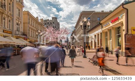 Locals and tourists walking on famous pedestrian Arbat Street timelapse hyperlapse in Moscow, Russia. 125633439