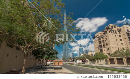 Walking on Dubai street Dubai Skyline timelapse hyperlapse. Residential and Business Skyscrapers in Downtown Walking on Dubai street Dubai Skyline timelapse hyperlapse. Residential and Business Skyscrapers in Downtown 125633466