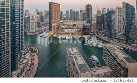 Evening illumination of Dubai Marina day to night aerial timelapse, UAE. 125633481