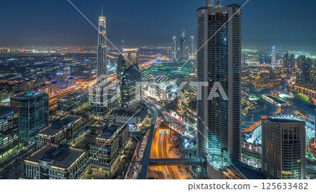 Dubai Downtown day to night timelapse modern towers panoramic view from the top in Dubai, United Arab Emirates. Dubai Downtown day to night timelapse modern towers panoramic view from the top in Dubai, United Arab Emirates. 125633482