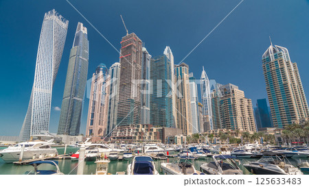 Dubai marina bay with yachts an boats timelapse hyperlapse 125633483