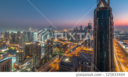 Dubai Downtown day to night timelapse modern towers panoramic view from the top in Dubai, United Arab Emirates. 125633484