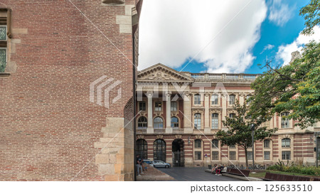 Renaissance dungeon clock tower and classical brick facade of the Capitole timelapse hyperlapse, city hall of Toulouse, France Renaissance dungeon clock tower and classical brick facade of the Capitole timelapse hyperlapse, city hall of Toulouse, France 125633510