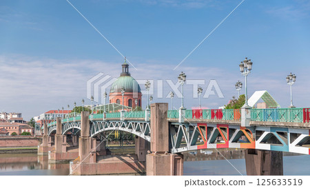 Saint Pierre Bridge over the Garonne River timelapse hyperlapse and La Grave Hospital. Toulouse, France Saint Pierre Bridge over the Garonne River timelapse hyperlapse and La Grave Hospital. Toulouse, France 125633519