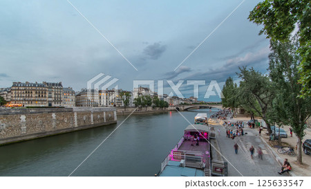 View to the Pont De La Tournelle on the River Seine day to night timelapse with waterfront. 125633547