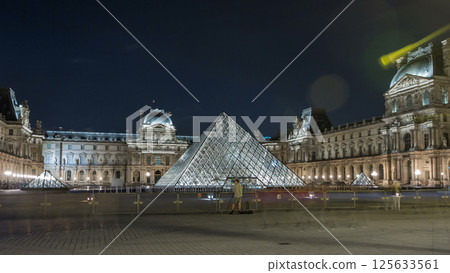 View of famous Louvre Museum with Louvre Pyramid at night timelapse hyperlapse. Paris, France View of famous Louvre Museum with Louvre Pyramid at night timelapse hyperlapse. Paris, France 125633561