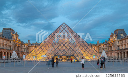 The Louvre museum pyramid after sunset day to night timelapse in Paris, France The Louvre museum pyramid after sunset day to night timelapse in Paris, France 125633563