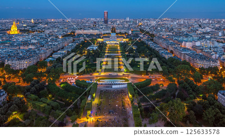 Aerial view of a large city skyline after sunset day to night timelapse. Top view from the Eiffel tower. Paris, France. Aerial view of a large city skyline after sunset day to night timelapse. Top view from the Eiffel tower. Paris, France. 125633578