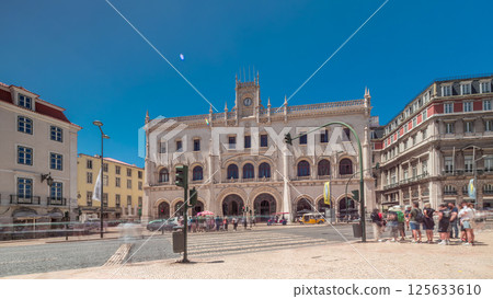 Rossio station in Lisbon timelapse hyperlapse. Front view with zebra crossing and street traffic. Rossio station in Lisbon timelapse hyperlapse. Front view with zebra crossing and street traffic. 125633610