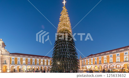 Commerce Square in Lisbon illuminated at Christmas day to night hyperlapse, with a towering tree. Portugal 125633632