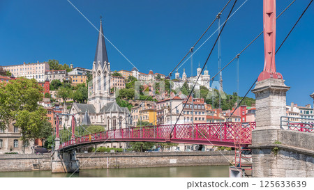 Timelapse hyperlapse of Saint George Church, Quais de Saone, and Fourviere Basilica from a footbridge in Vieux Lyon, France 125633639