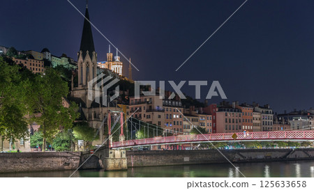 Timelapse hyperlapse of Saint George Church at night, Quais de Saone and Fourviere Basilica from a footbridge in Vieux Lyon, France Timelapse hyperlapse of Saint George Church at night, Quais de Saone and Fourviere Basilica from a footbridge in Vieux Lyon, France 125633658