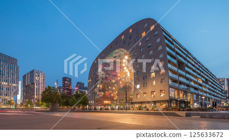 Hyperlapse of the Rotterdamse Markthal's exterior day to night timelapse. Netherlands Hyperlapse of the Rotterdamse Markthal's exterior day to night timelapse. Netherlands 125633672