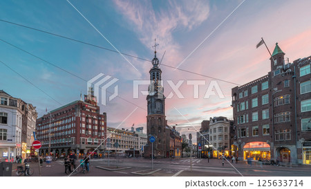 Munttoren tower and flowers market. Panoramic day to night timelapse hyperlapse of Amsterdam city center. Netherlands 125633714