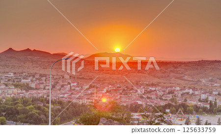 Sunset view from old castle in historical city town of Nevsehir aerial timelapse 125633759