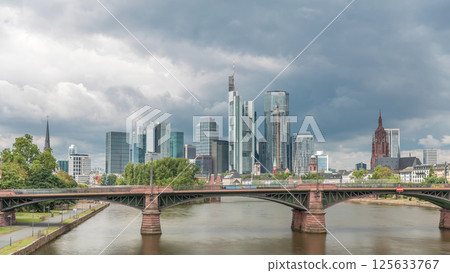Aerial hyperlapse of Frankfurt skyline with Main River and Ignatz Bubis Bridge. Frankfurt, Germany 125633767