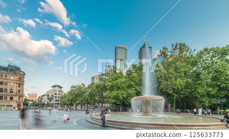 Opera Square timelapse hyperlapse in downtown Frankfurt, Germany, showcases a fountain with skyscrapers Opera Square timelapse hyperlapse in downtown Frankfurt, Germany, showcases a fountain with skyscrapers 125633773