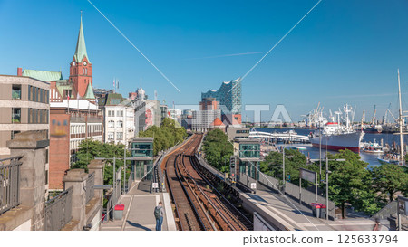 Aerial hyperlapse of trains arriving at Landungsbrucken station in Hamburg, Germany 125633794