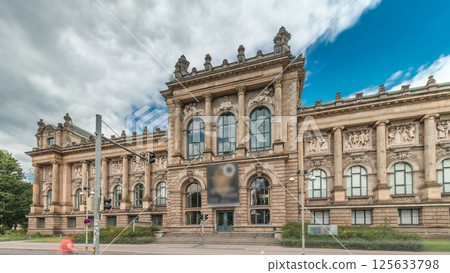 Hyperlapse of Hanover's Lower Saxony State Museum with passing traffic and people in front of its historic facade. Germany 125633798