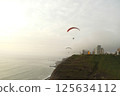 Paragliders gliding over the coast of Miraflores, Lima, Peru 125634112