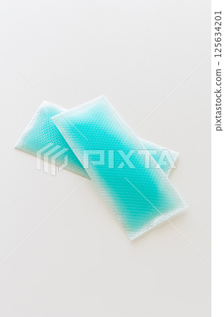Cooling gel sheet for when you have a fever on a white background 125634201
