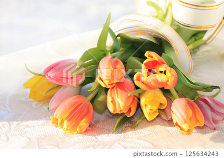 A bouquet of flowers on the window, a wonderful gift for loved ones, the approach of spring A bouquet of flowers on the window, a wonderful gift for loved ones, the approach of spring 125634243