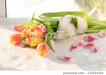 A bouquet of flowers on the window, a wonderful gift for loved ones, the approach of spring 125634245