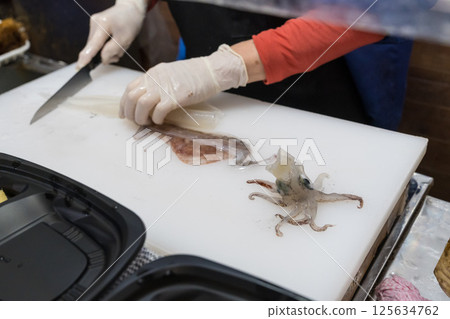 Scene of preparing live squid from Hakodate Scene of preparing live squid from Hakodate 125634762