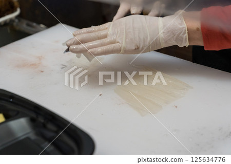Scene of preparing live squid from Hakodate 125634776