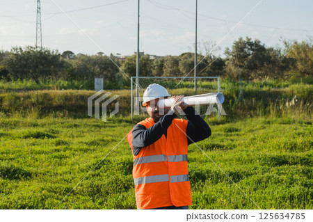 Engineer Using Document As Binoculars Engineer Using Document As Binoculars 125634785