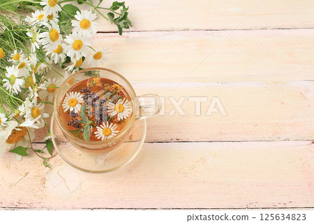Floral composition of wild herbs and flowers on a wooden table in a rustic style, autumn background, tansy, Floral composition of wild herbs and flowers on a wooden table in a rustic style, autumn background, tansy, 125634823