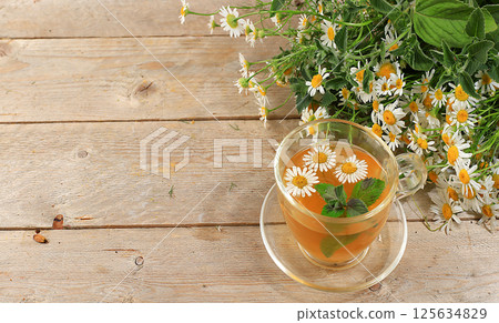 Floral composition of wild herbs and flowers on a wooden table in a rustic style, autumn background, tansy, Floral composition of wild herbs and flowers on a wooden table in a rustic style, autumn background, tansy, 125634829