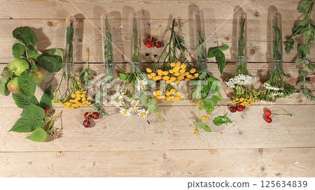 Floral composition of wild herbs and flowers on a wooden table in a rustic style, autumn background, tansy,  125634839