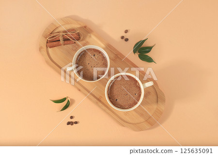 Coffee drink with milk, chocolate and whipped cream, cappuccino coffee, latte, cinnamon, coffee beans on a light table, modern coffee shop advertisement, minimal creative composition, selective focus, Coffee drink with milk, chocolate and whipped cream, cappuccino coffee, latte, cinnamon, coffee beans on a light table, modern coffee shop advertisement, minimal creative composition, selective focus, 125635091